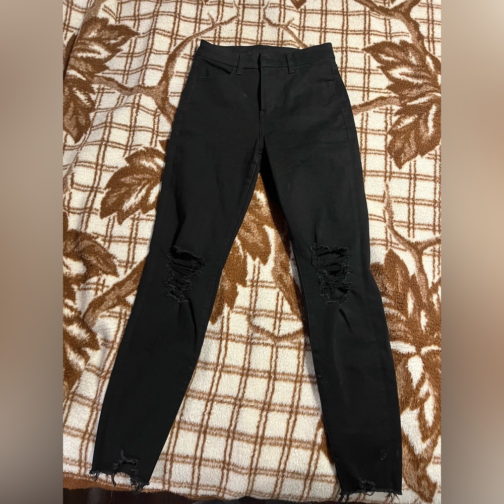 Selling American eagle black jeans with the style having some rips in them